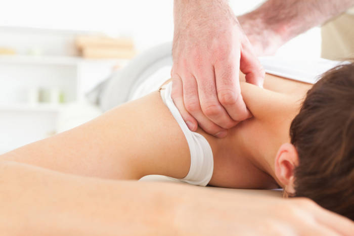 Woman-receiving-chiropractic-care-to-relax-her-shoulders.jpg