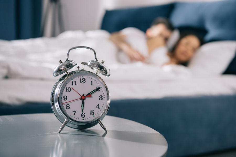 An-alarm-clock-placed-away-from-the-bed.jpg